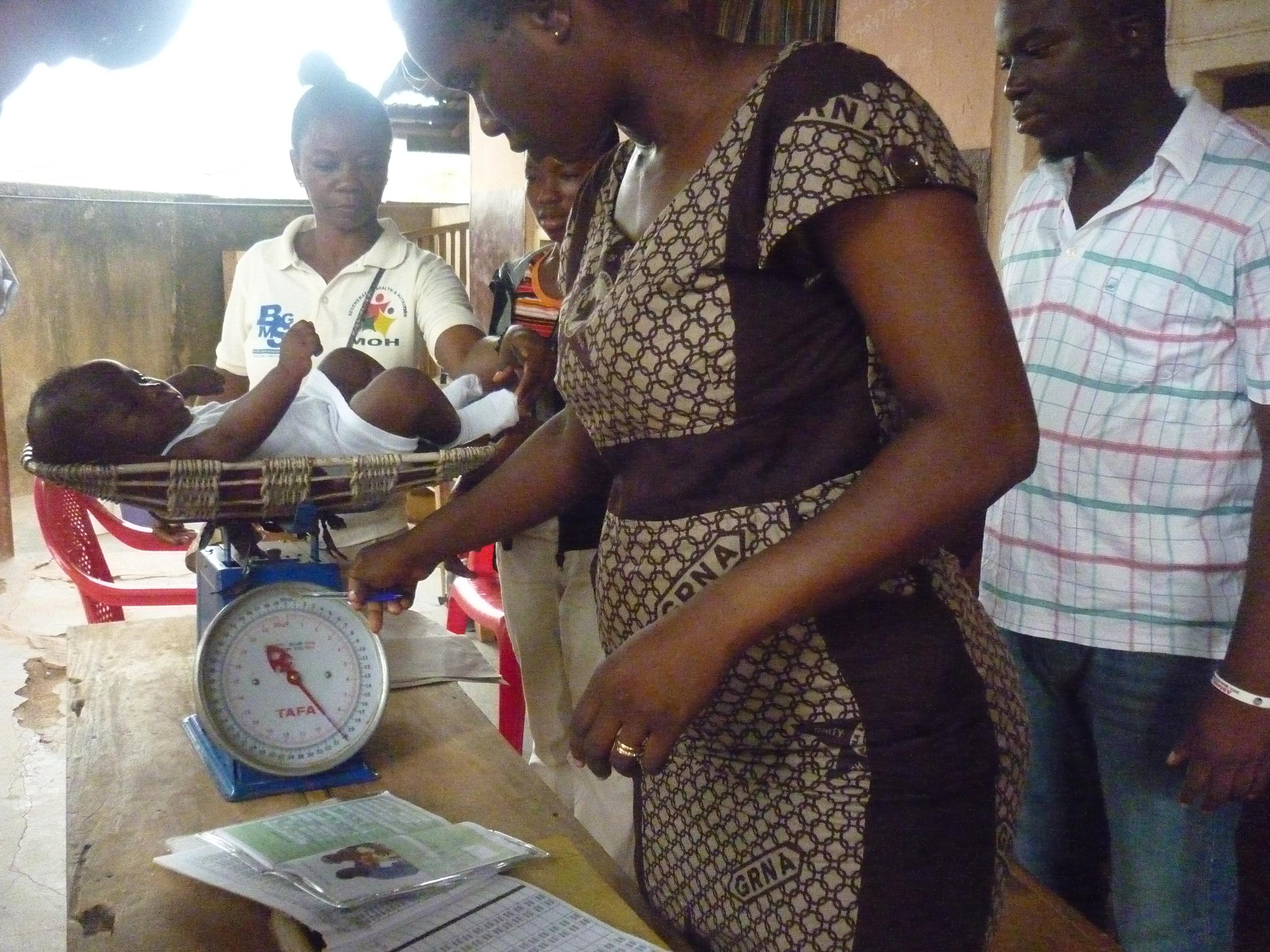 Interns observe local doctors whilst conducting a check up on a local boy during their midwifery internship in Ghana with Projects Abroad. Projects Abroad students undertaking Midwifery internships in Ghana observing local doctors whilst performing a check up on a baby.